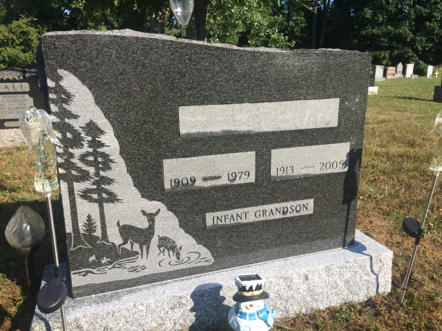 custom charcoal granite gravestone in a cemetary